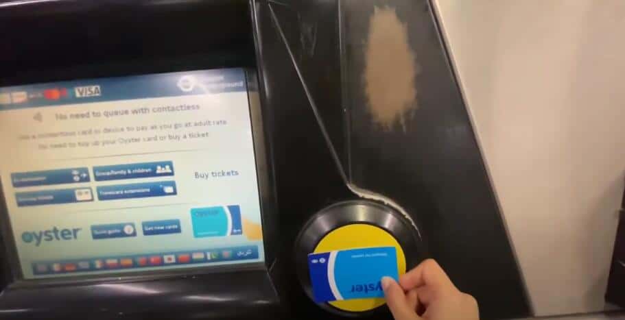 Touch your oyster card on the yellow reader